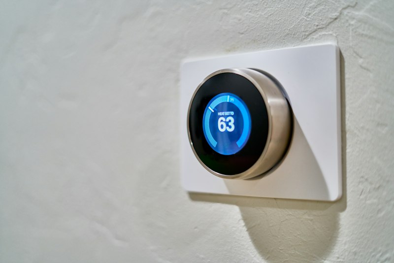 Modern energy-efficient climate control thermostat in a residential home